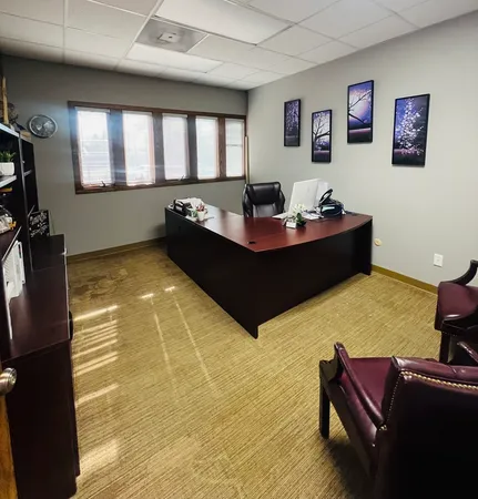a room with furniture pool table flat screen tv and windows
