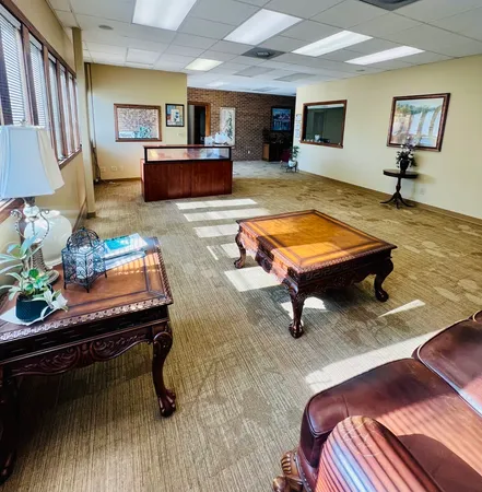 a living room with furniture and a table
