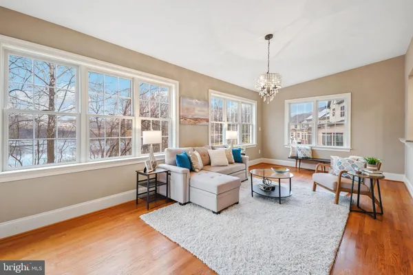 a kitchen with kitchen island granite countertop wooden floors granite counter tops and a window