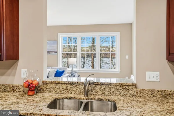 a bathroom with a sink a vanity and a mirror