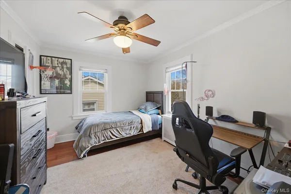 a bedroom with a bed and a desk