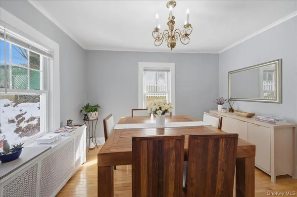 a view of a dining room with furniture window and outside view