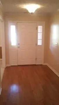 an empty room with a empty space and window