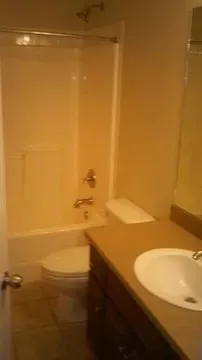 a bathroom with a bathtub and shower