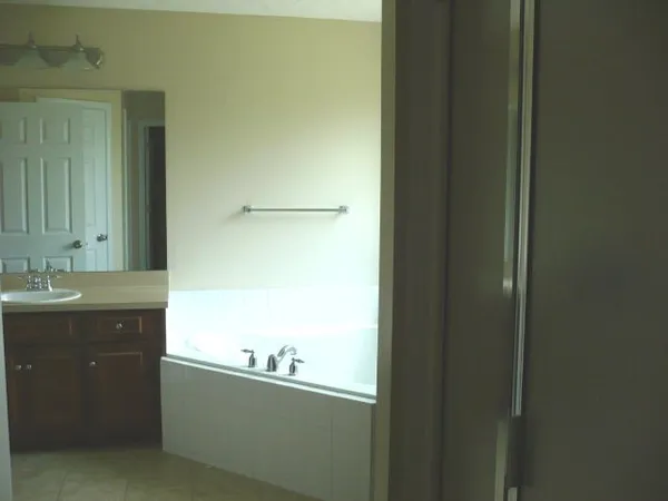 a bathroom with a sink and mirror