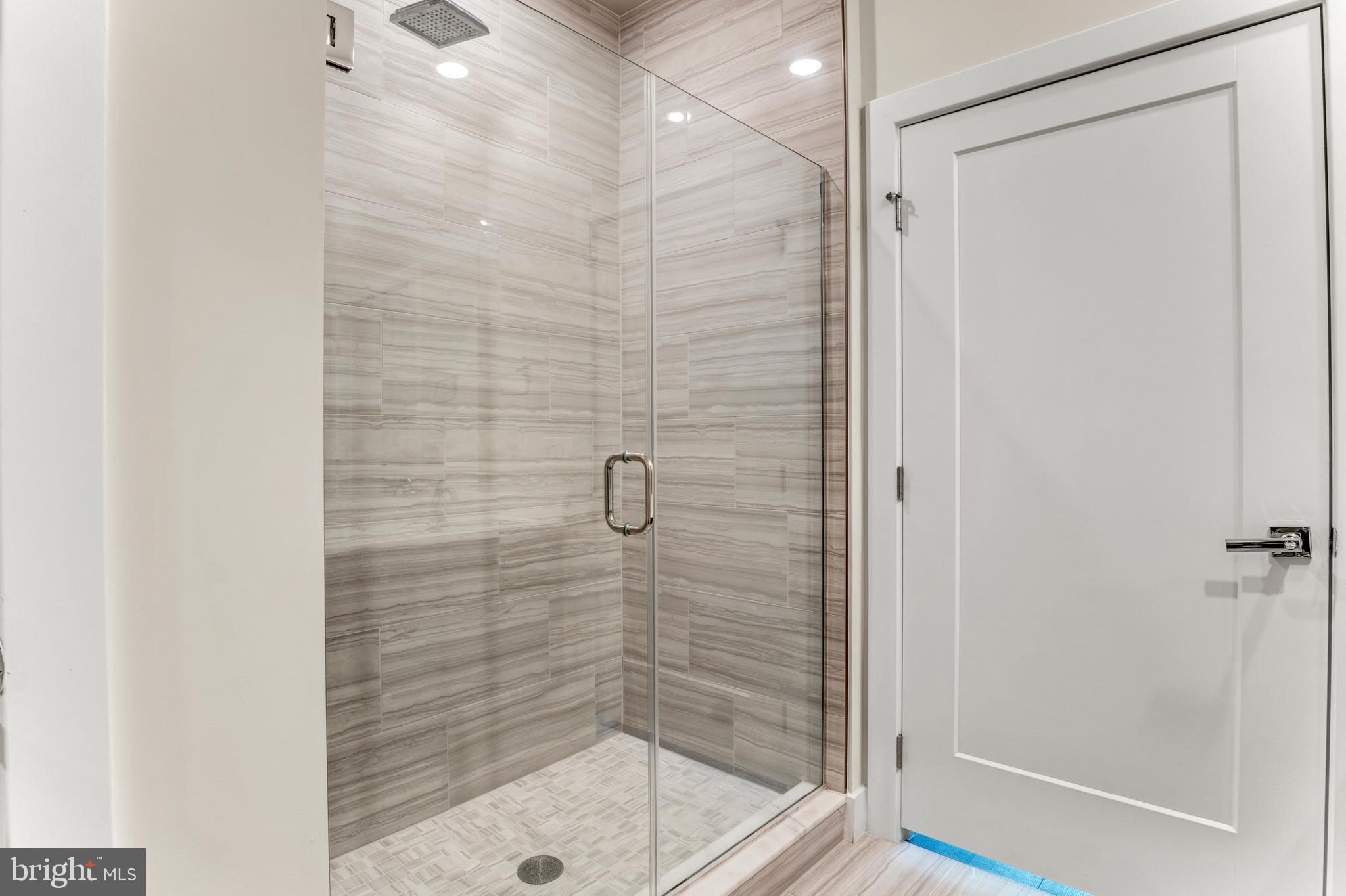 1761 Old Meadow Road, Unit 209 McLean, VA 22102 - Photo 17 of 49 a bathroom with a shower