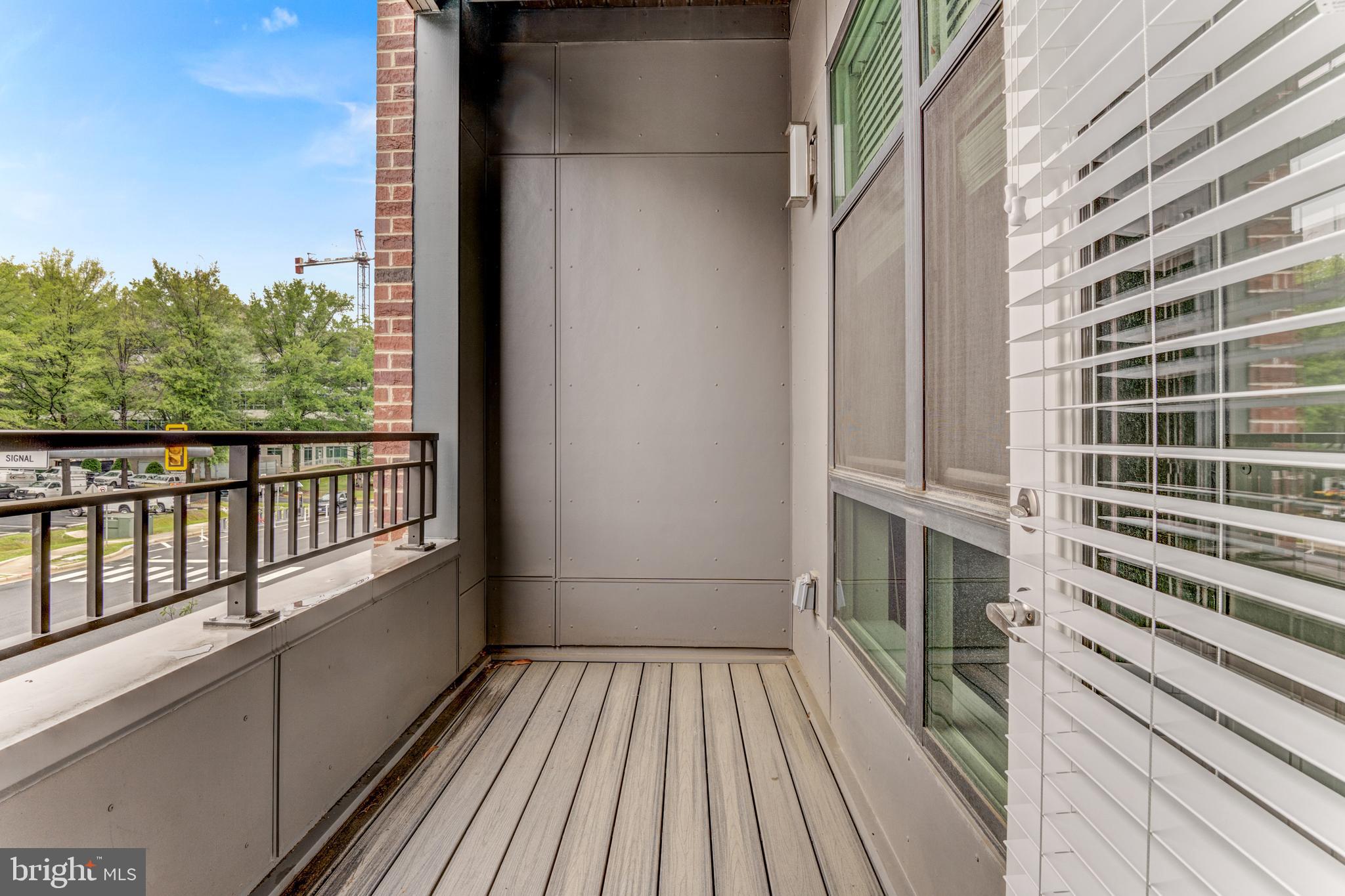 1761 Old Meadow Road, Unit 209 McLean, VA 22102 - Photo 23 of 49 a view of balcony with wooden floor