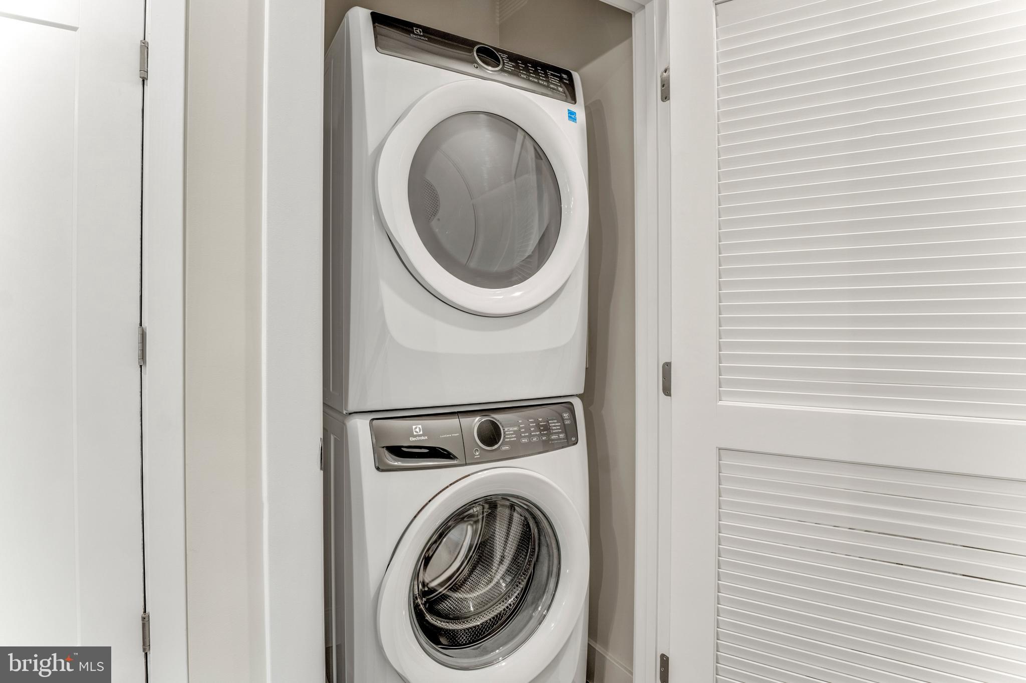 1761 Old Meadow Road, Unit 209 McLean, VA 22102 - Photo 25 of 49 a utility room with dryer and washer
