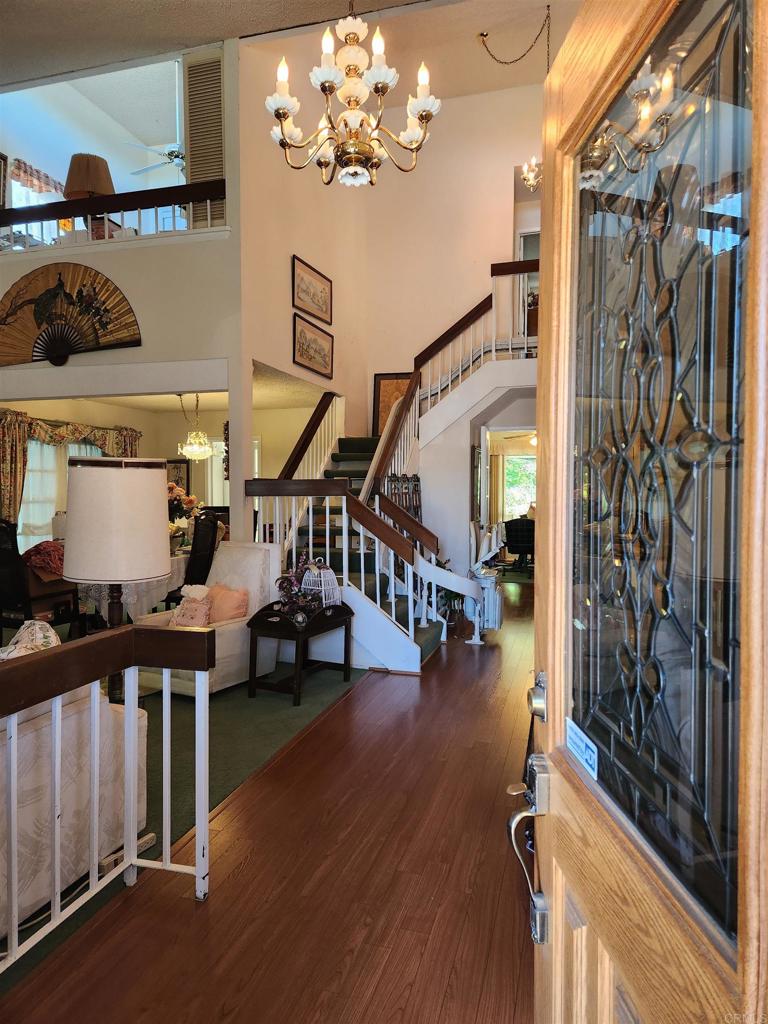 1722 Firestone Drive Escondido, CA 92026 - Photo 11 of 72 a room with lots of residential furniture and wooden floor