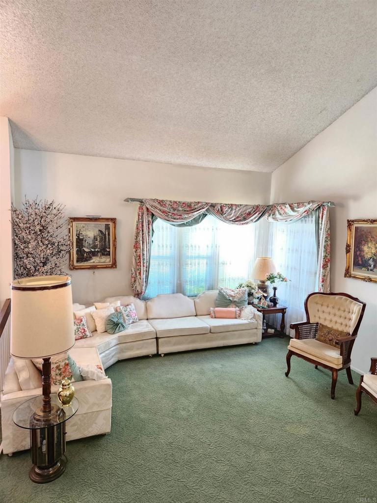 1722 Firestone Drive Escondido, CA 92026 - Photo 16 of 72 a living room with furniture and a window