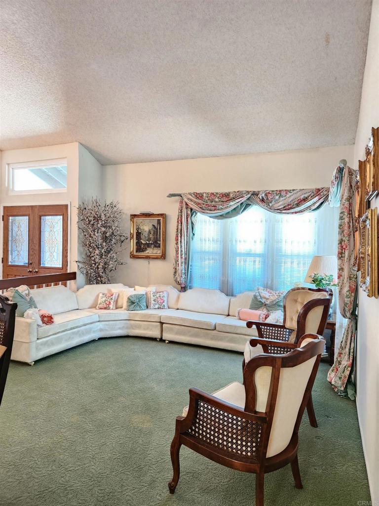 1722 Firestone Drive Escondido, CA 92026 - Photo 18 of 72 a living room with furniture and a wooden floor