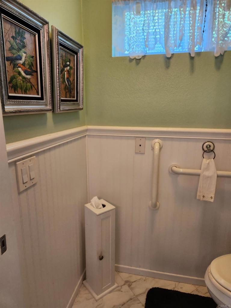 1722 Firestone Drive Escondido, CA 92026 - Photo 34 of 72 a bathroom with a shower and toilet