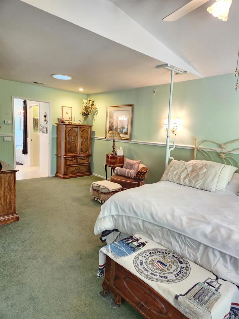 1722 Firestone Drive Escondido, CA 92026 - Photo 40 of 72 a spacious bedroom with two beds and a couch