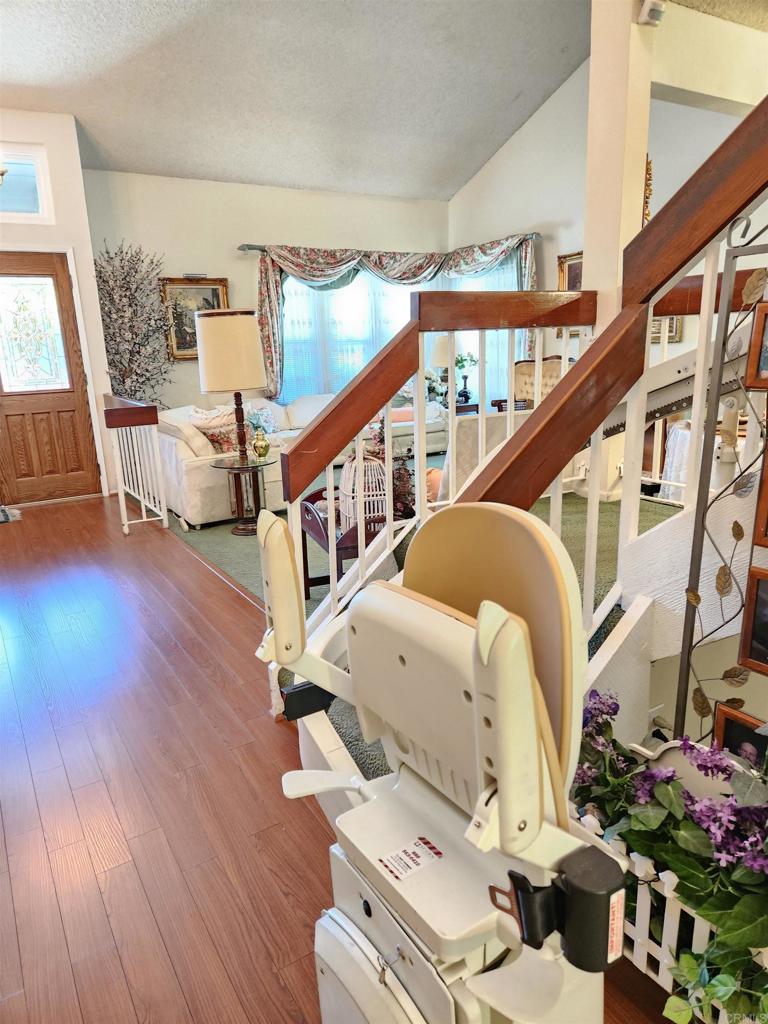 1722 Firestone Drive Escondido, CA 92026 - Photo 48 of 72 a living room with furniture and a wooden floor