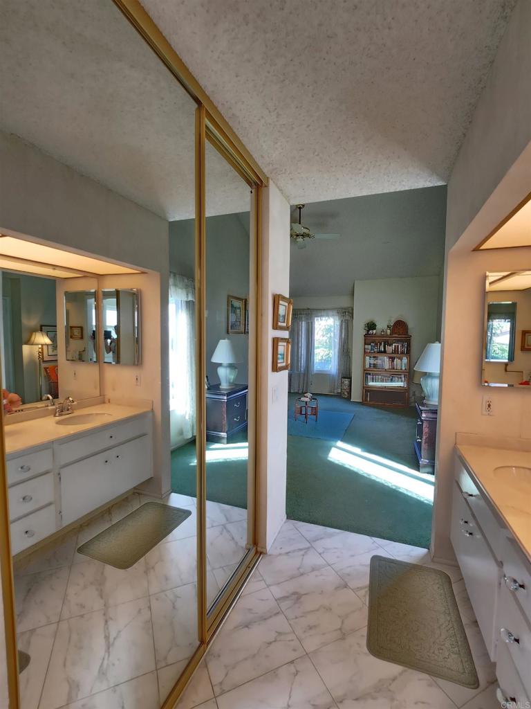 1722 Firestone Drive Escondido, CA 92026 - Photo 59 of 72 a spacious bathroom with a tub and mirror