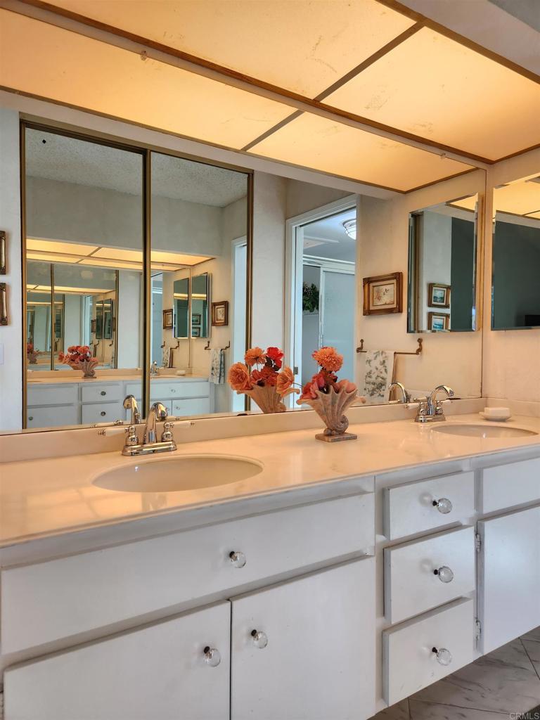 1722 Firestone Drive Escondido, CA 92026 - Photo 60 of 72 a bathroom with sink mirror and vanity