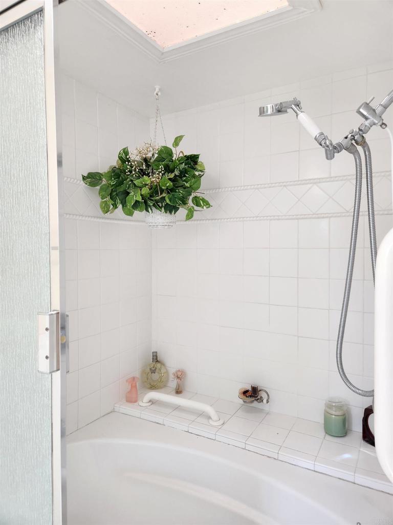 1722 Firestone Drive Escondido, CA 92026 - Photo 62 of 72 a bathroom with a bathtub and a shower