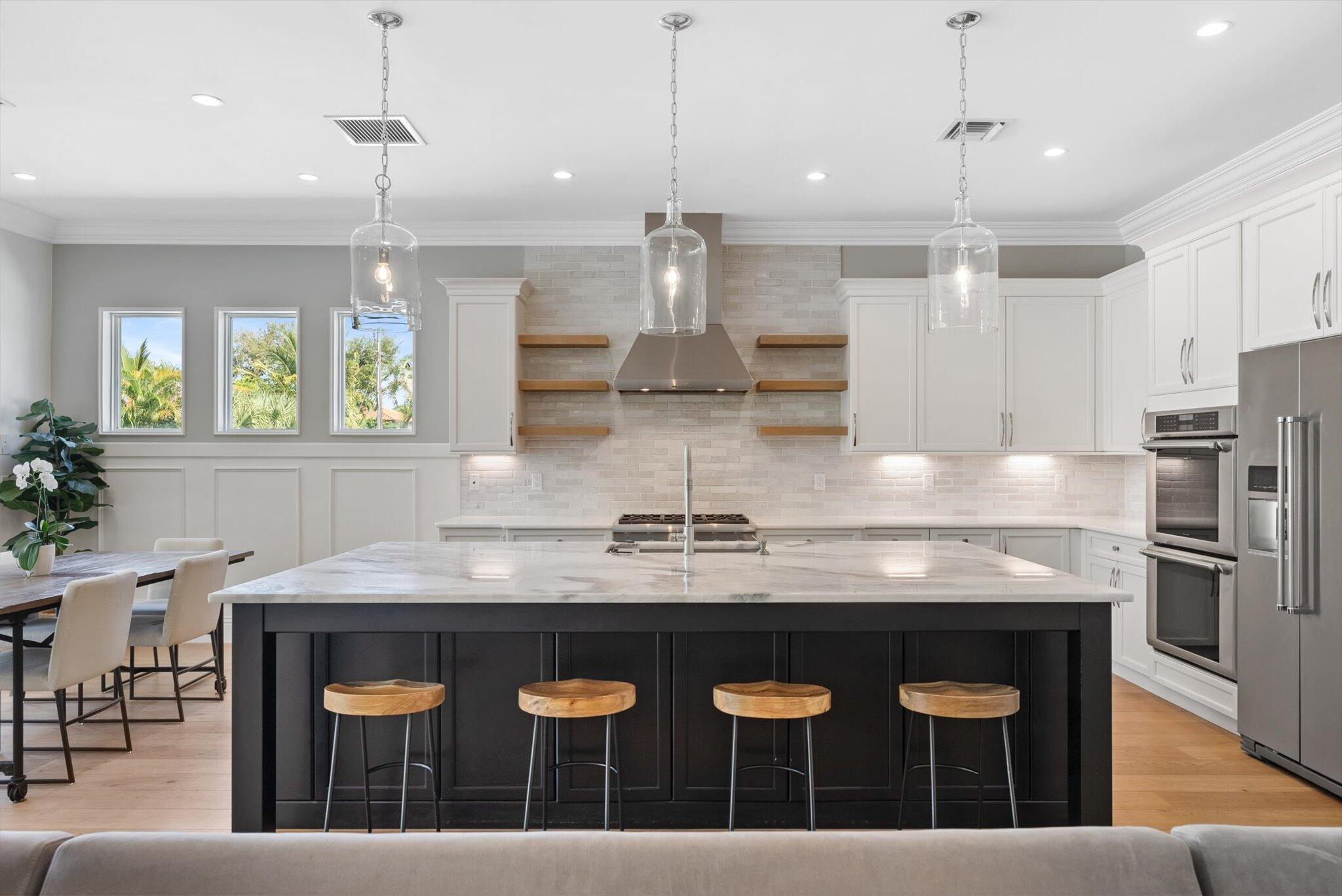 1301 Southwest 15th Street Boca Raton, FL 33486 - Photo 14 of 54 a kitchen with a counter space window and cabinets