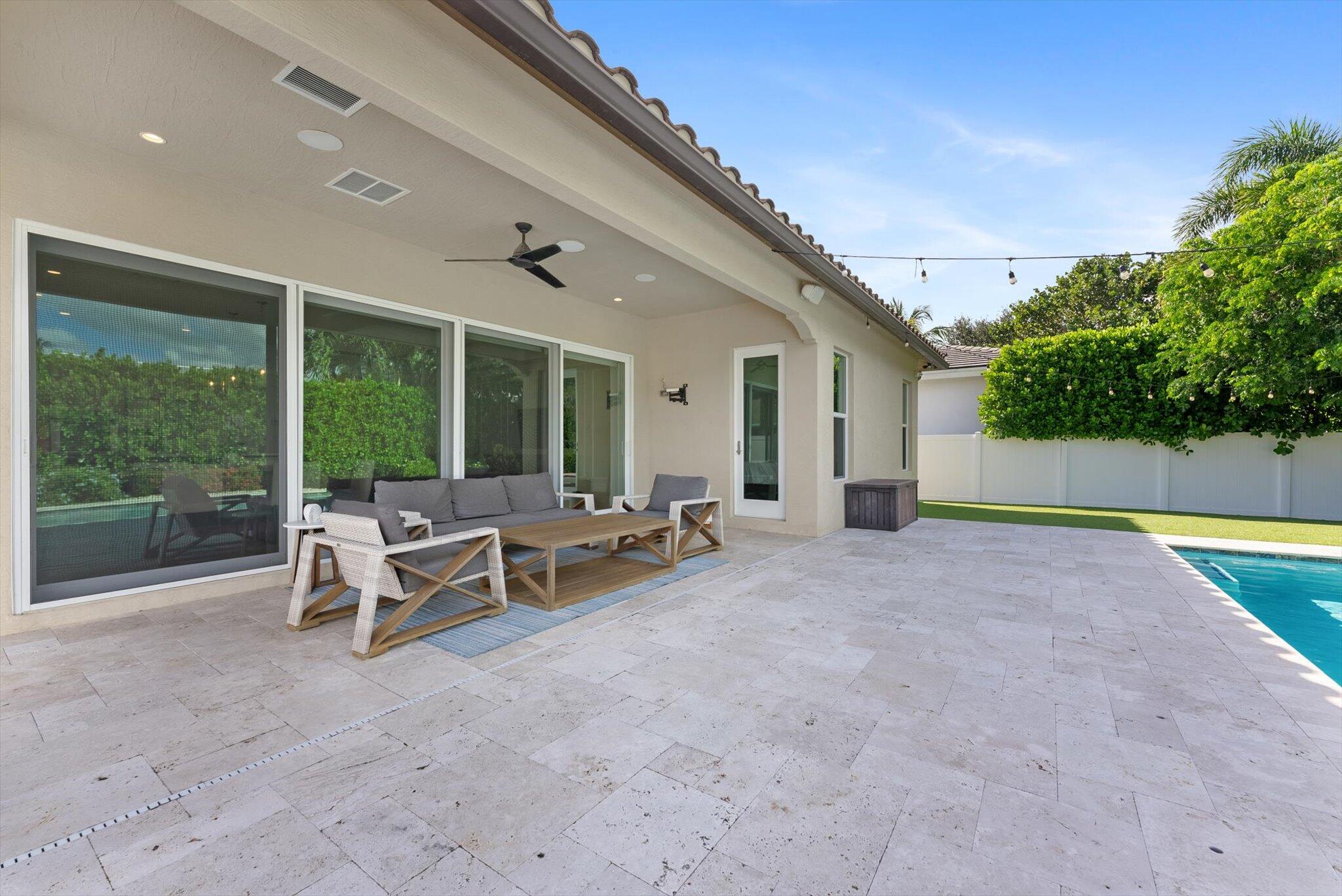 1301 Southwest 15th Street Boca Raton, FL 33486 - Photo 18 of 54 a view of a house with backyard and sitting area