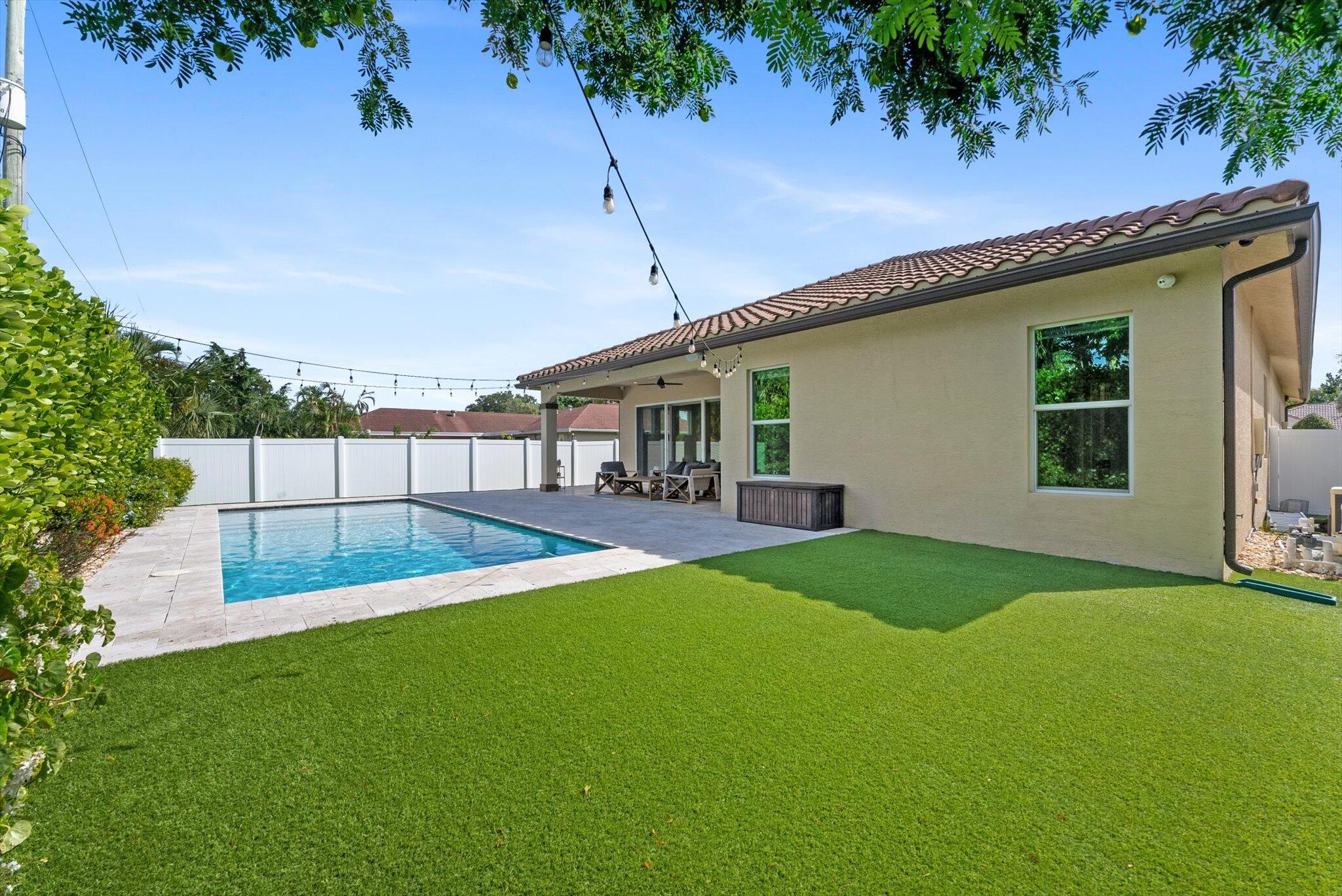 1301 Southwest 15th Street Boca Raton, FL 33486 - Photo 22 of 54 a view of a backyard with a garden and plants