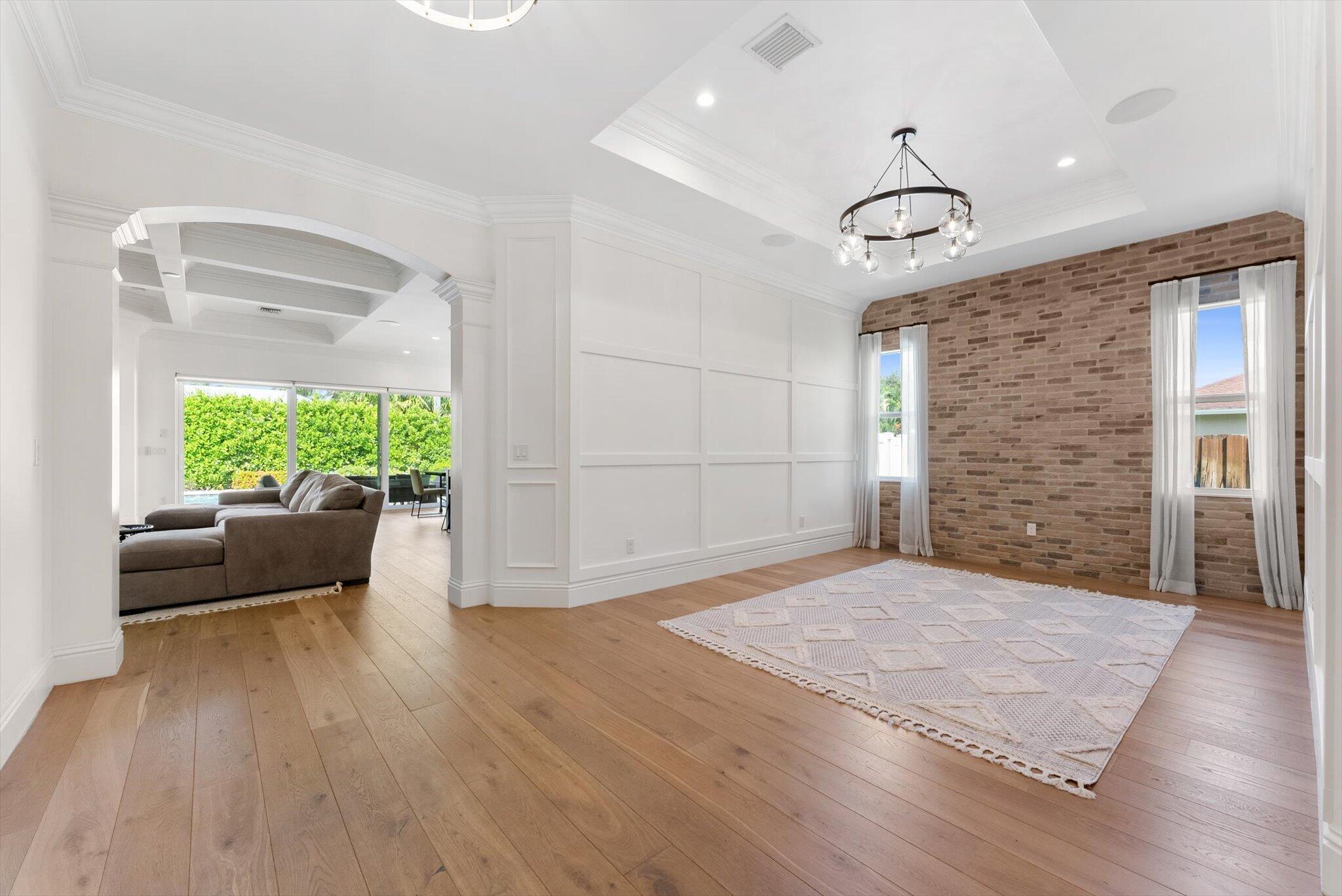 1301 Southwest 15th Street Boca Raton, FL 33486 - Photo 23 of 54 a view of an empty room with wooden floor and a window