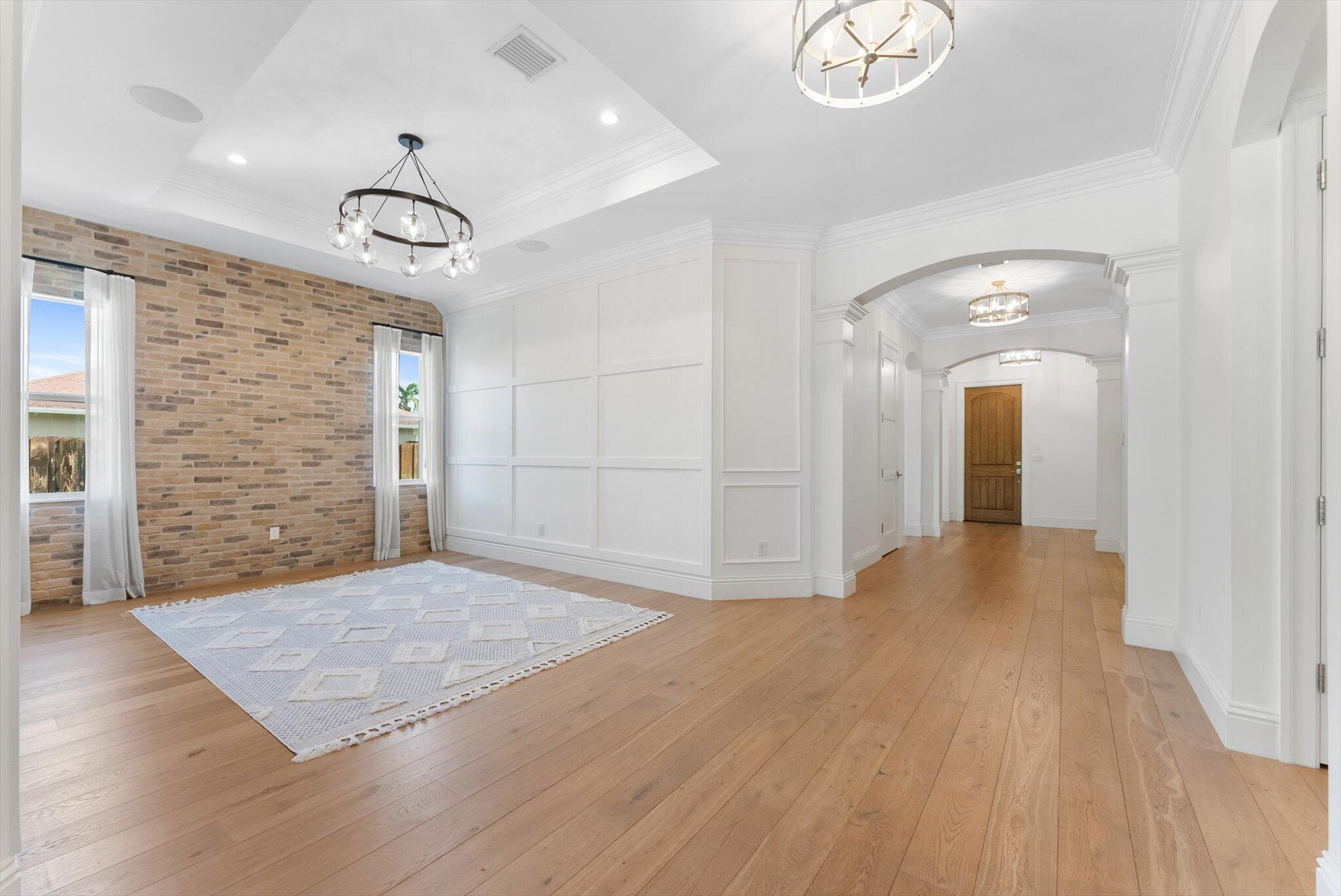 1301 Southwest 15th Street Boca Raton, FL 33486 - Photo 24 of 54 an empty room with wooden floor and windows
