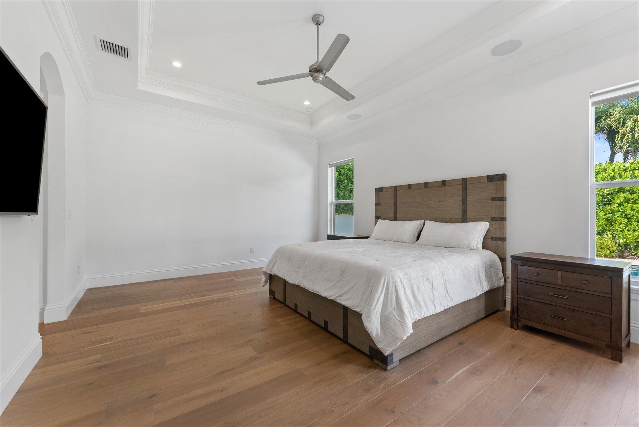 1301 Southwest 15th Street Boca Raton, FL 33486 - Photo 27 of 54 a bedroom with a bed a dresser and a window
