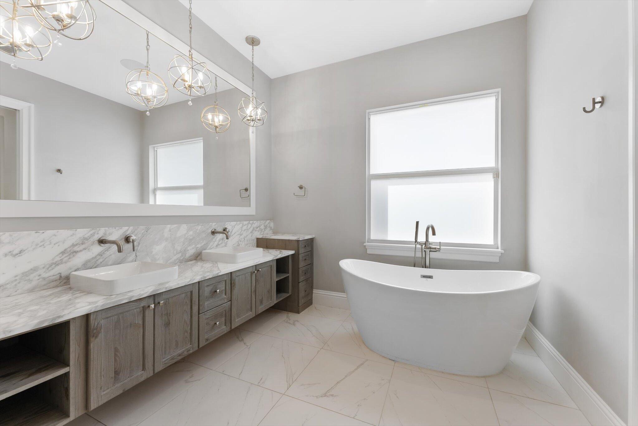 1301 Southwest 15th Street Boca Raton, FL 33486 - Photo 32 of 54 a spacious bathroom with a tub sink and mirror