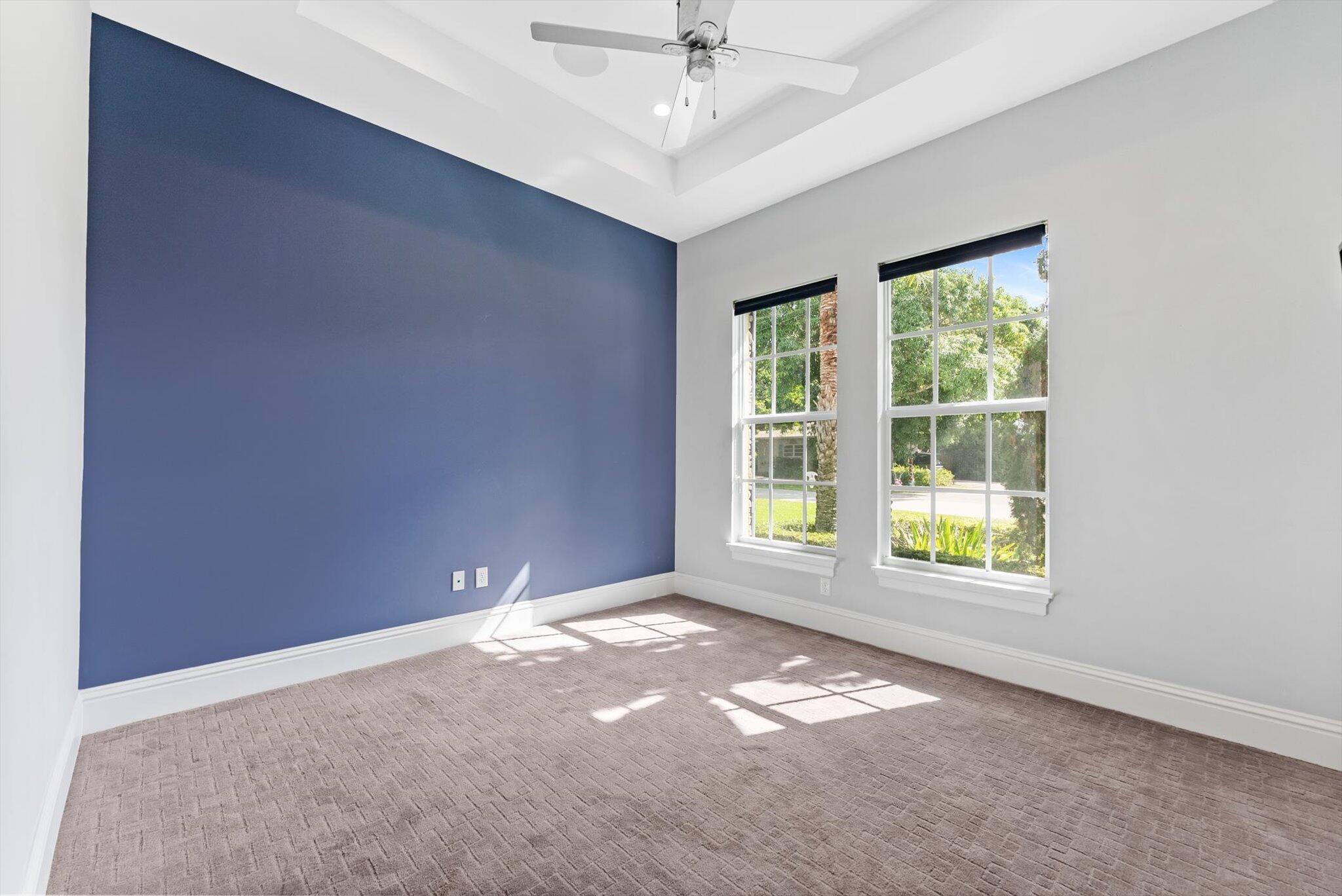 1301 Southwest 15th Street Boca Raton, FL 33486 - Photo 33 of 54 an empty room with windows and ceiling fan
