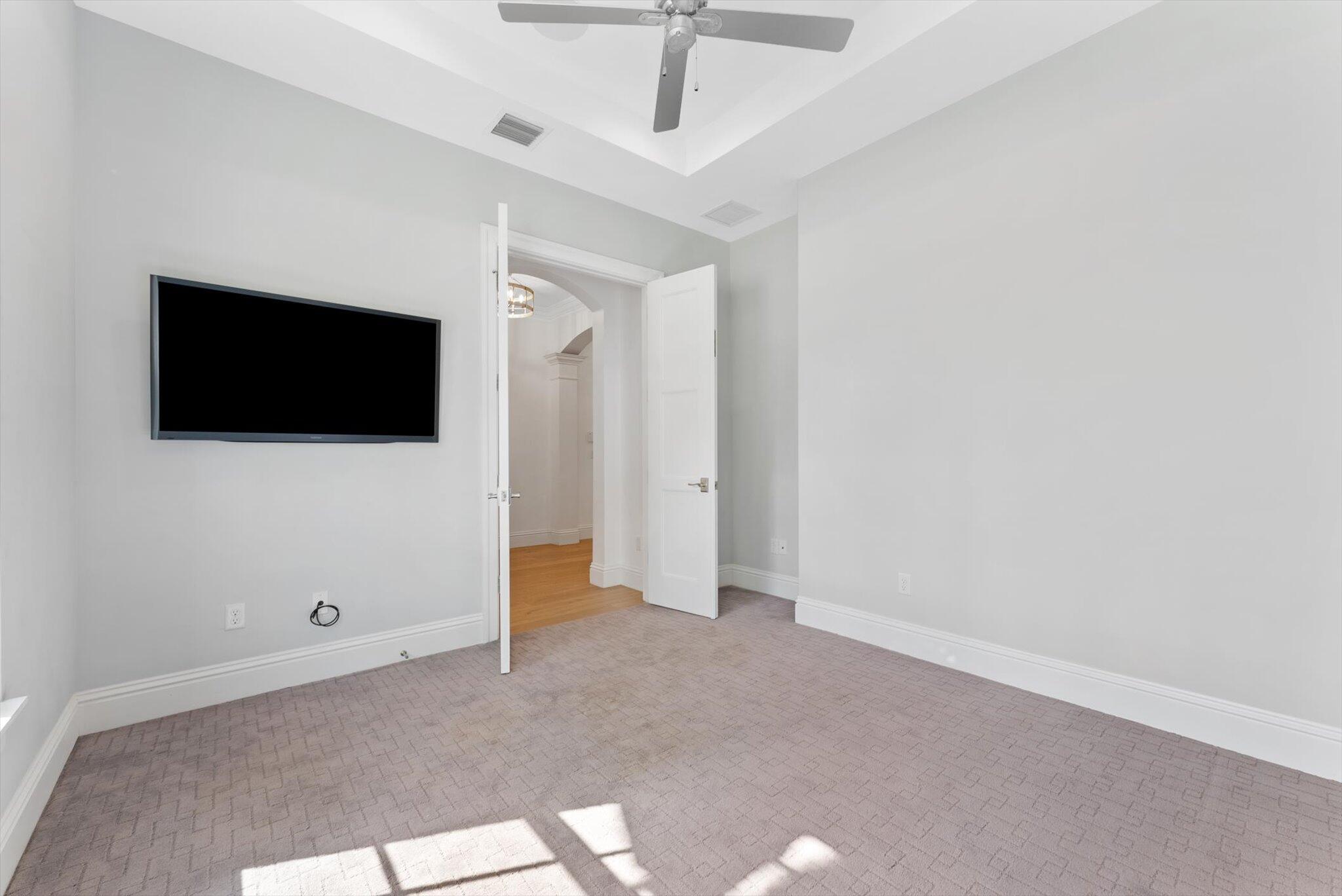 1301 Southwest 15th Street Boca Raton, FL 33486 - Photo 34 of 54 a view of an empty room with a flat screen tv