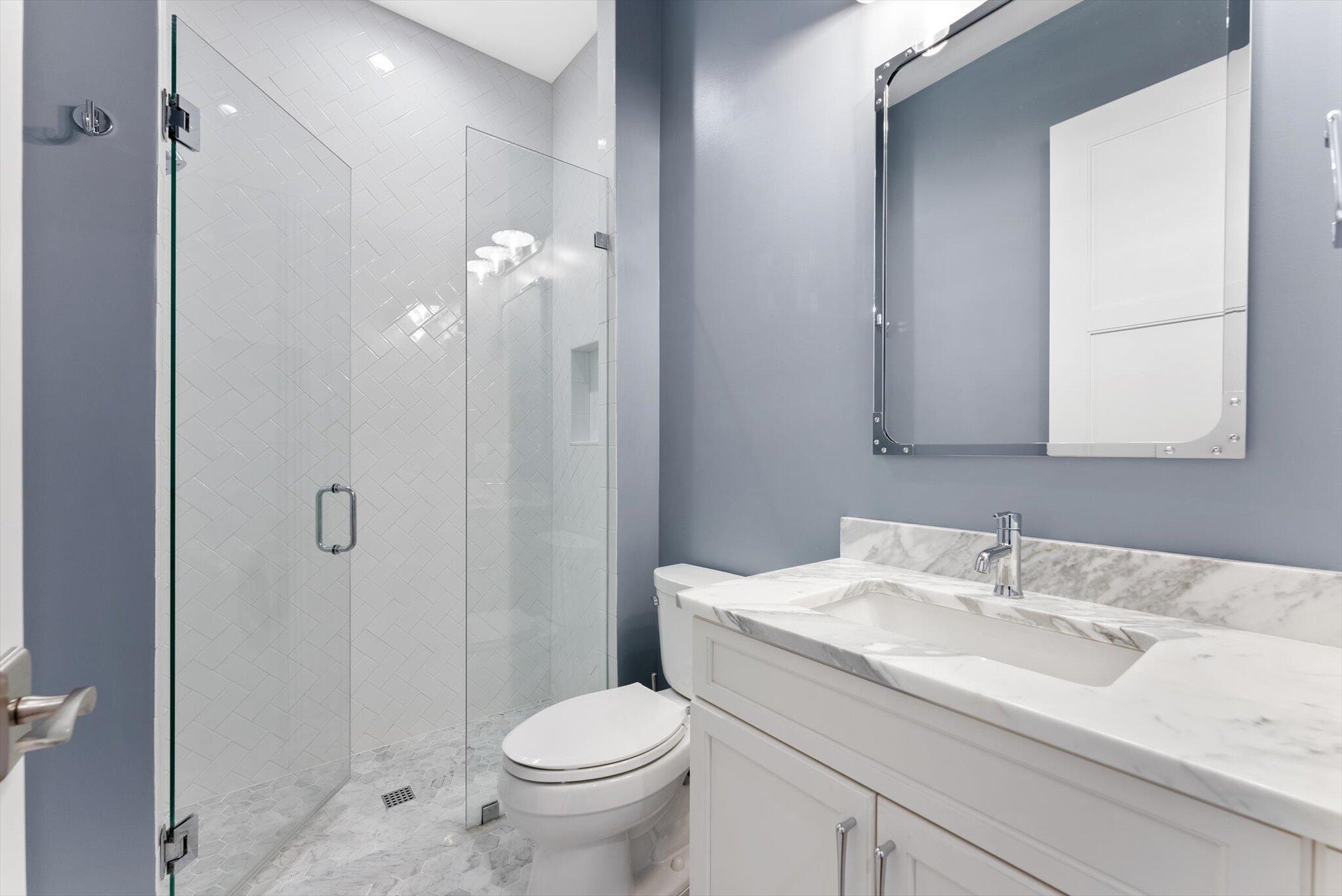 1301 Southwest 15th Street Boca Raton, FL 33486 - Photo 37 of 54 a bathroom with a sink toilet and shower