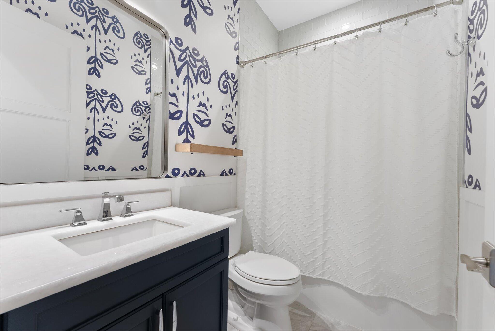 1301 Southwest 15th Street Boca Raton, FL 33486 - Photo 42 of 54 a bathroom with a sink and a mirror