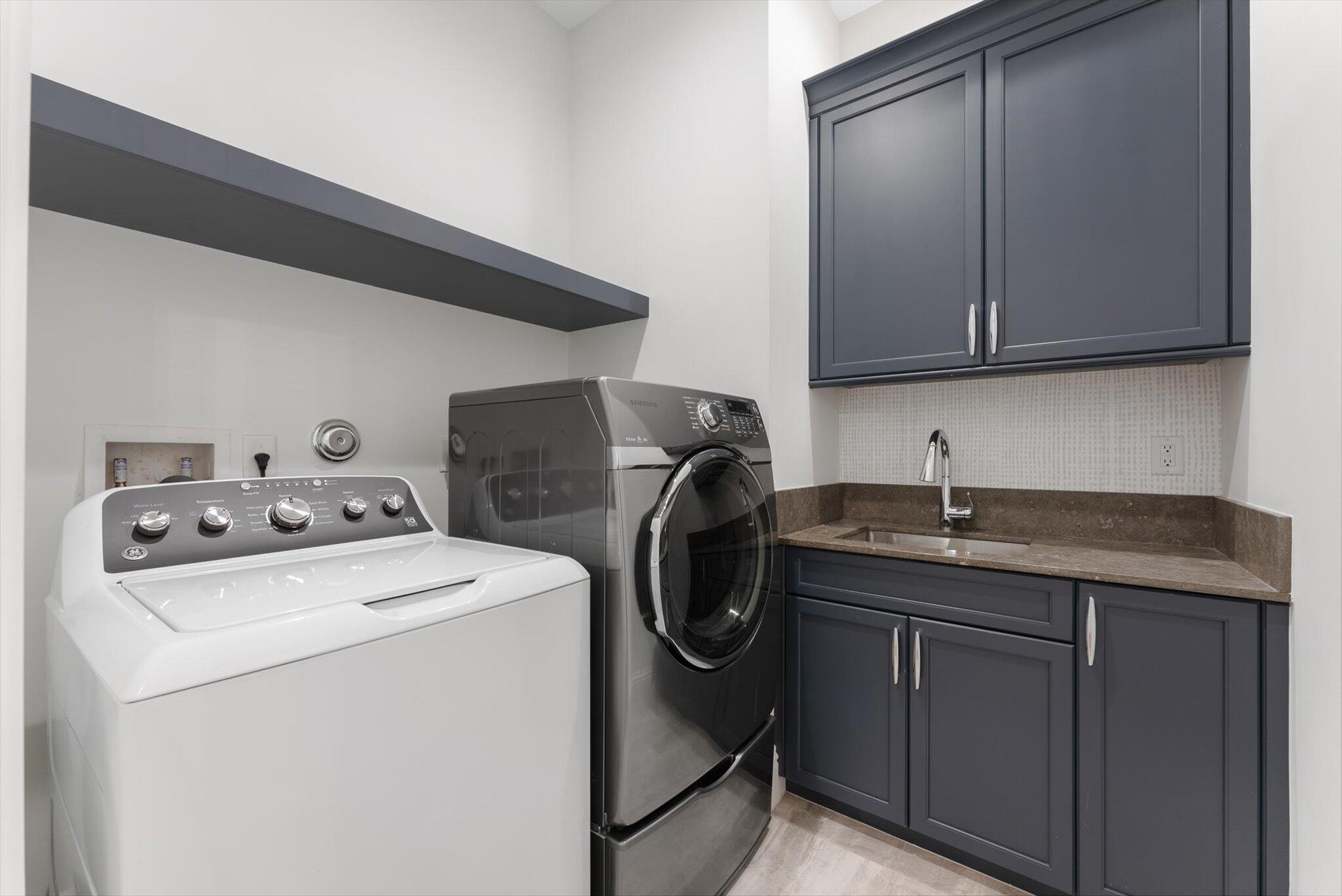 1301 Southwest 15th Street Boca Raton, FL 33486 - Photo 43 of 54 a utility room with sink dryer and washer