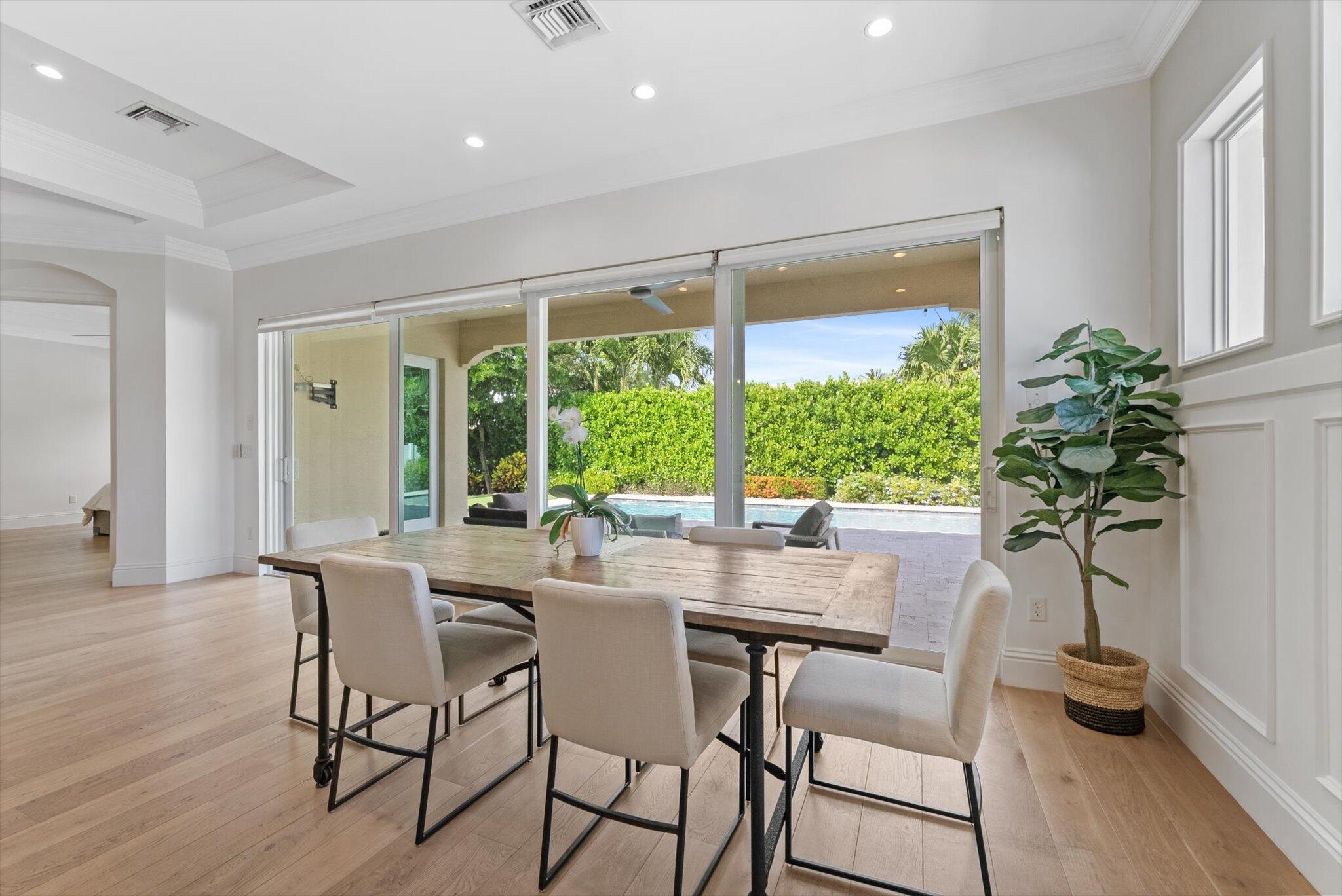 1301 Southwest 15th Street Boca Raton, FL 33486 - Photo 6 of 54 a view of a dining room with furniture window and wooden floor