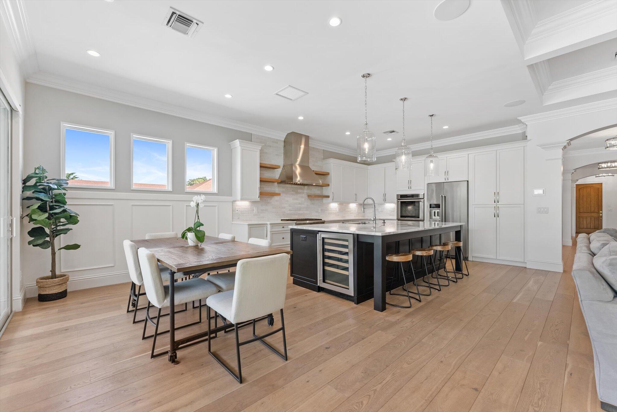 1301 Southwest 15th Street Boca Raton, FL 33486 - Photo 7 of 54 a kitchen with a table and chairs in it