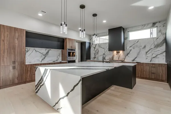 a spacious bathroom with a double vanity sink and a mirror