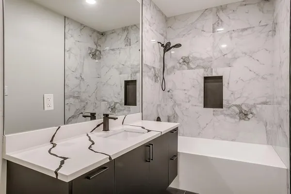 an empty room with windows and ceiling fan