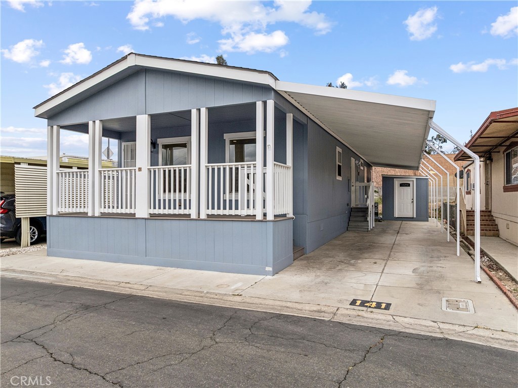 10550 Dunlap Crossing Road, Unit 141 Whittier, CA 90606 - Photo 26 of 38 a view of a house with a garage