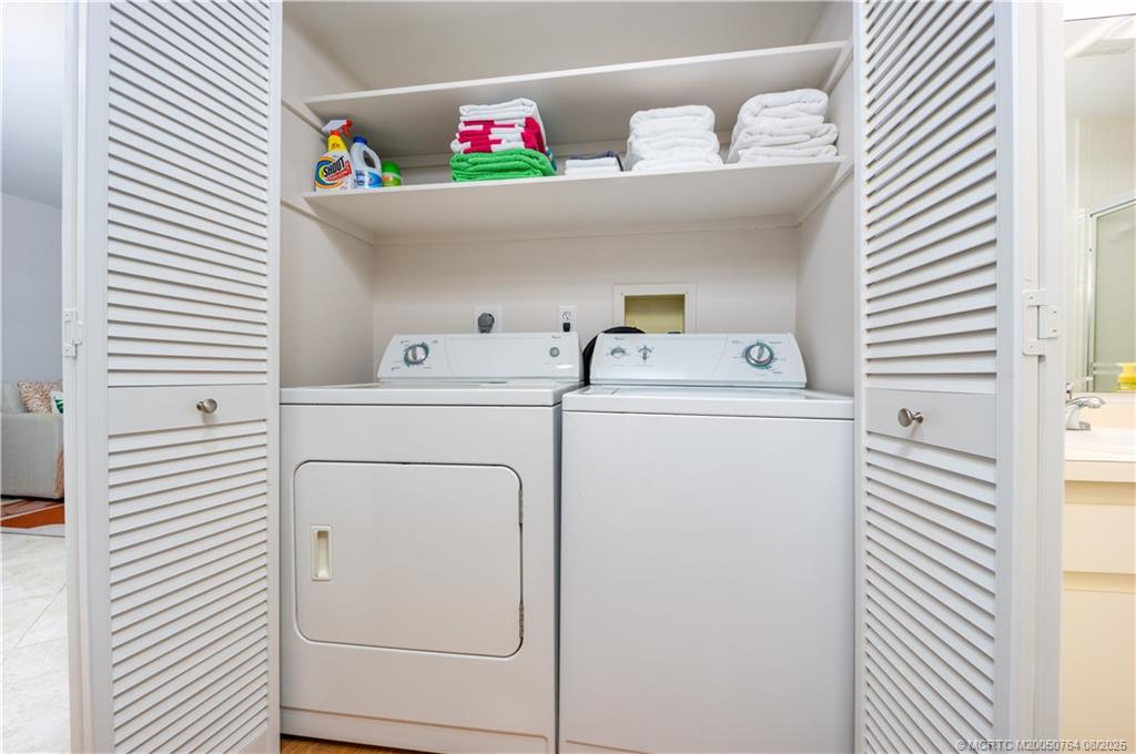 1550 Northeast Ocean Boulevard, Unit B304 Stuart, FL 34996 - Photo 11 of 19 a utility room with dryer and washer