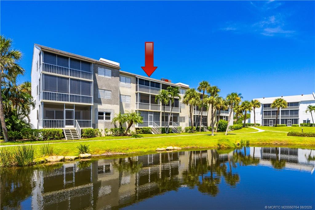 1550 Northeast Ocean Boulevard, Unit B304 Stuart, FL 34996 - Photo 19 of 19 a view of an house with a swimming pool