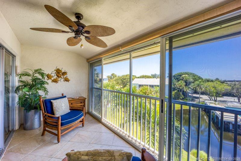 1550 Northeast Ocean Boulevard, Unit B304 Stuart, FL 34996 - Photo 3 of 19 a living room with furniture and a floor to ceiling window