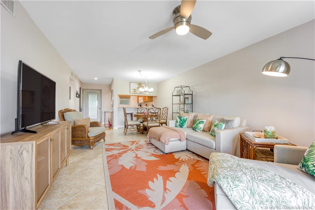 1550 Northeast Ocean Boulevard, Unit B304 Stuart, FL 34996 - Photo 5 of 19 a living room with furniture and a flat screen tv