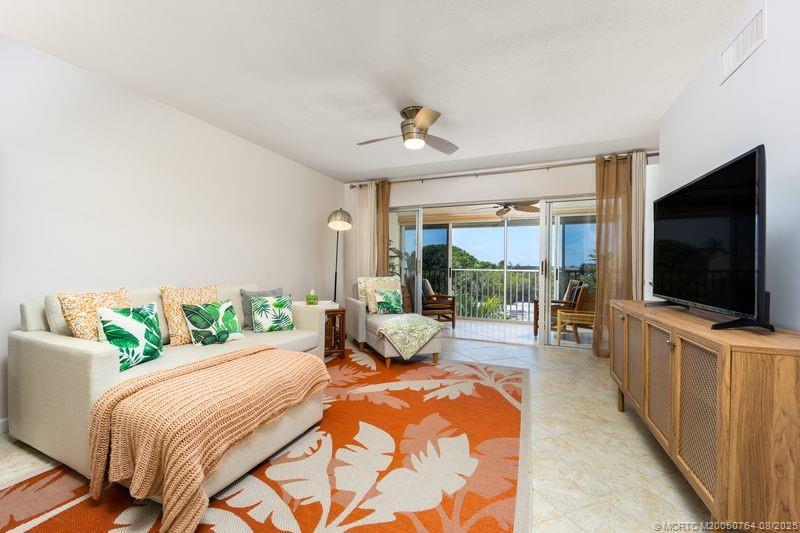 1550 Northeast Ocean Boulevard, Unit B304 Stuart, FL 34996 - Photo 6 of 19 a bedroom with a bed and large windows