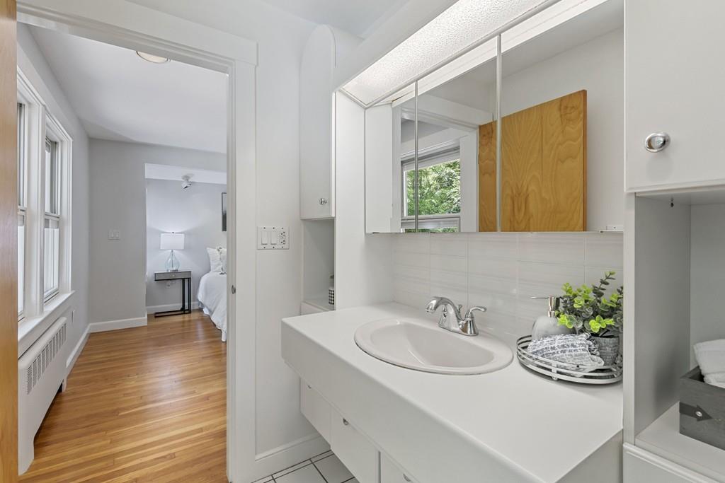 9 Baskin Road Lexington, MA 02421 - Photo 27 of 39 a bathroom with a sink and a mirror