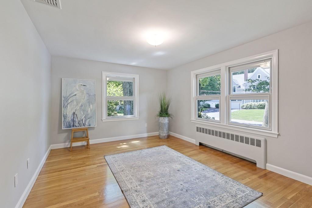 9 Baskin Road Lexington, MA 02421 - Photo 28 of 39 wooden floor in an empty room with a window