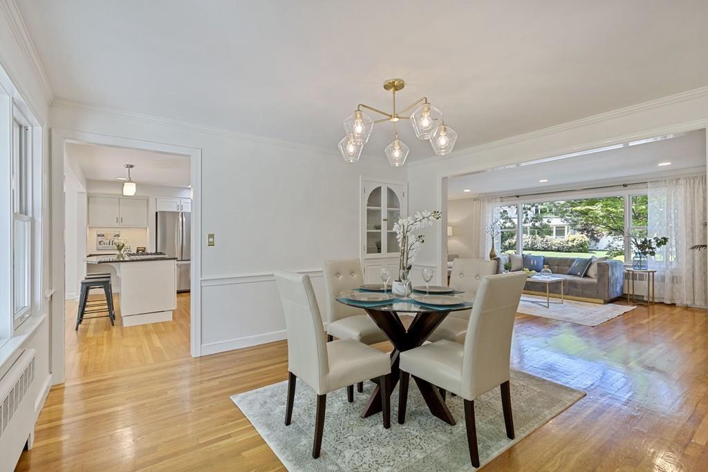 9 Baskin Road Lexington, MA 02421 - Photo 6 of 39 a view of a dining room with furniture and wooden floor