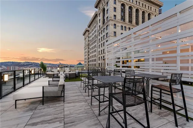 a view of a patio with couches table and chairs