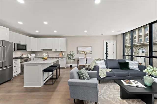 a kitchen with white cabinets and a stove