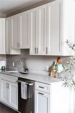 a living room with fireplace furniture and a wooden floor