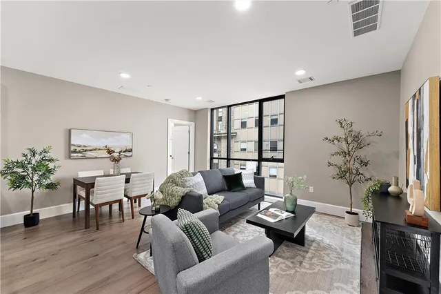 a dining room with furniture and chandelier